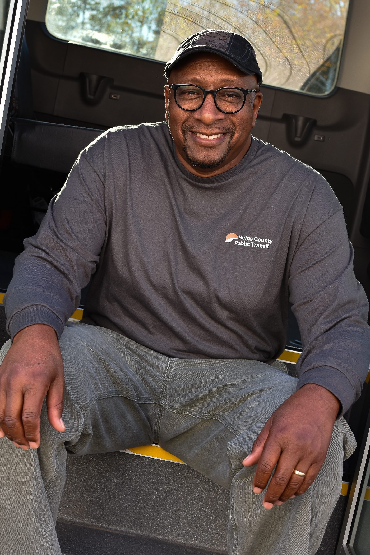An MCPT driver at the wheel of a transit van